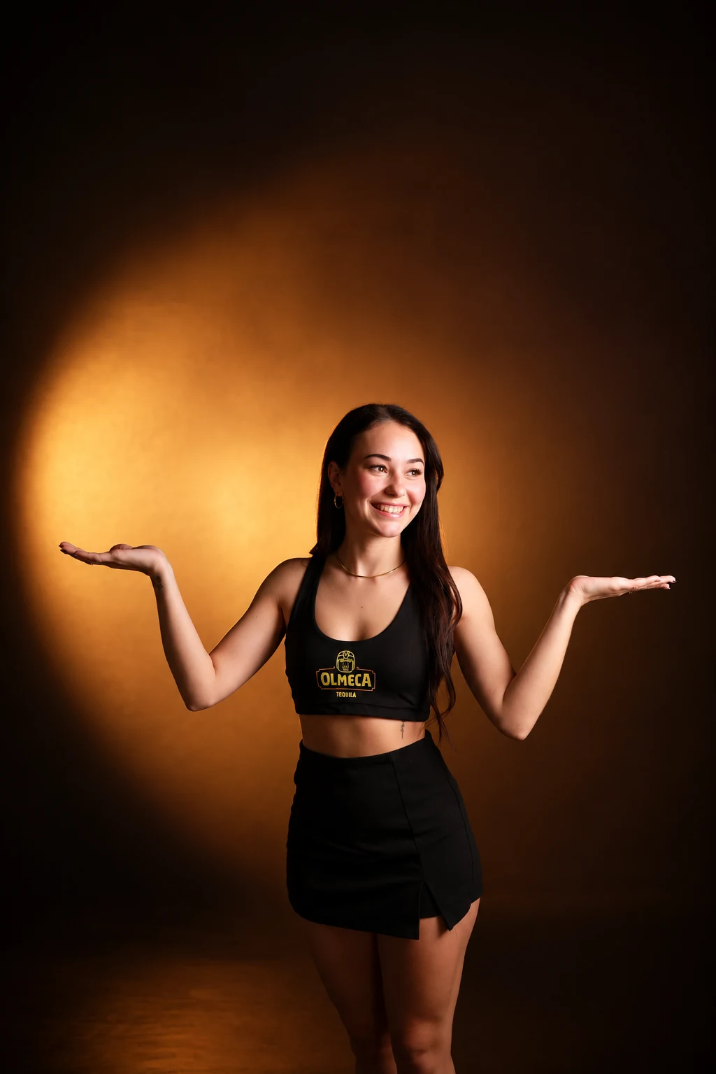Braize brand ambassador in Olmeca promotional attire, smiling with both hands raised